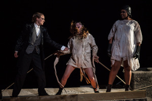All tied up - the insane Renfield (Bec Applebee) surrounded by Dr Seward (Helen Millar) and vampire (Kudzi Hudson)