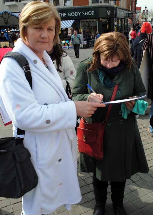 Cllr Coughlan in Walsall town centre collecting signatures.