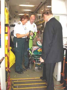 Sir Graham, Christine and Technician Andy Blakemore looking at the ParAid Child Restraint system. 