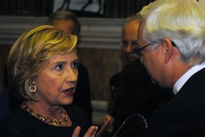 Ms Clinton talking to someone with white hair